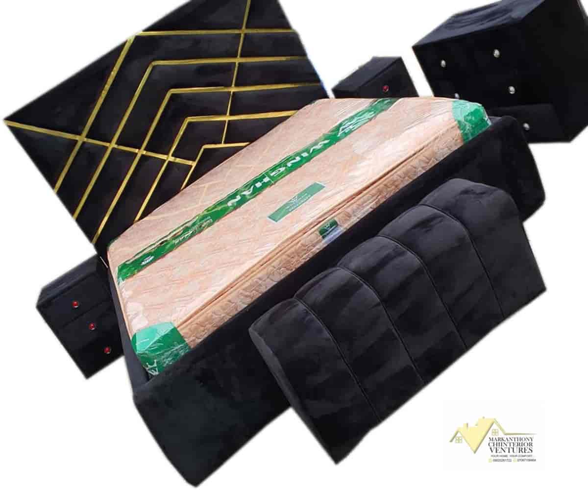 Black 6 by 6 padded bedframes with bedsides and Ottoman